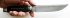 Нож Артиллерист (дамасская сталь, эбен, латунь, серебрение) авторский в руке