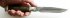 Нож Пехотинец (литой булат ламинированный дамаском, корень ореха, мельхиор) в руке